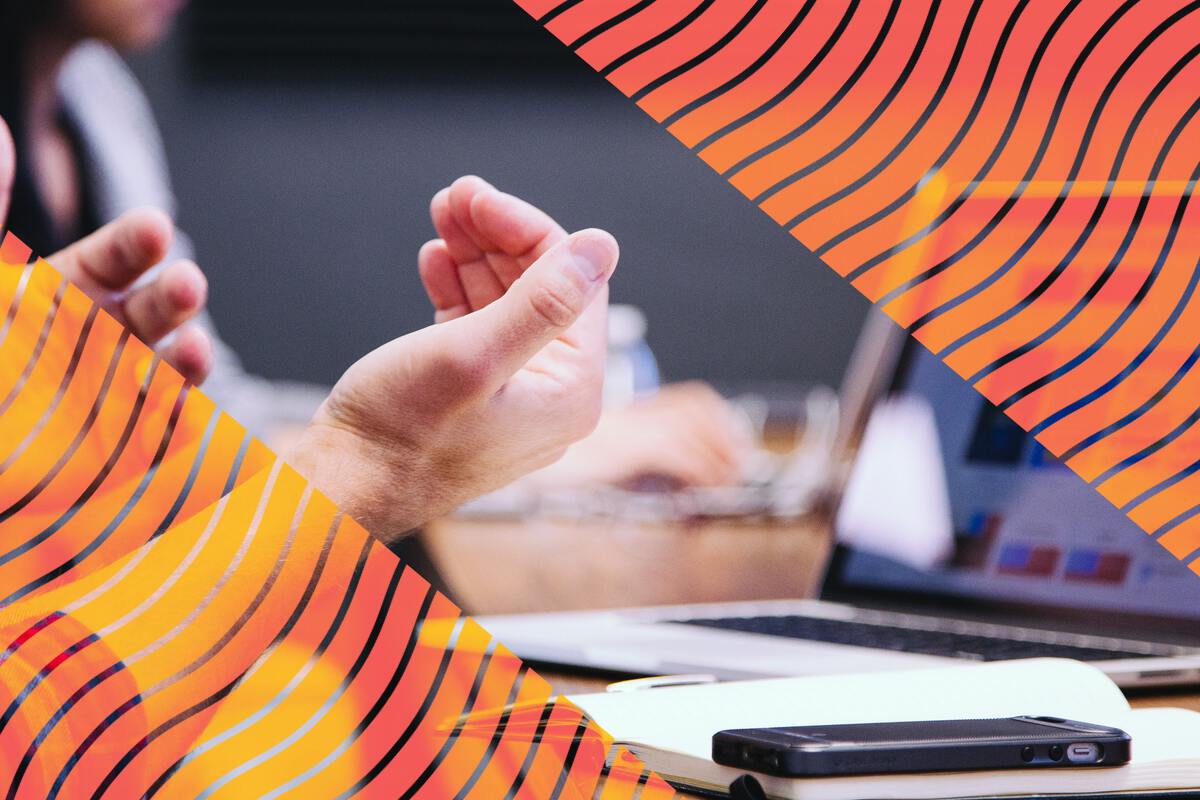 Person's hands in a meeting