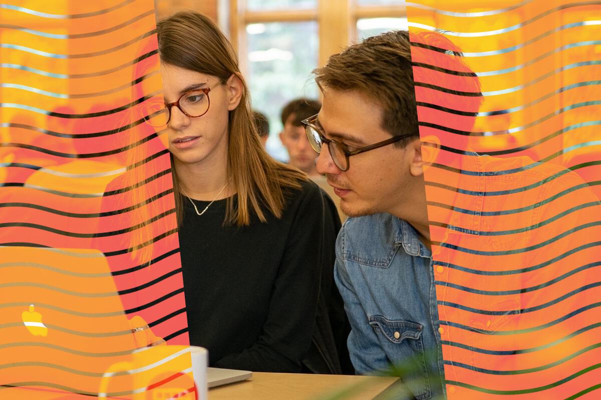 Two students looking at a computer screen