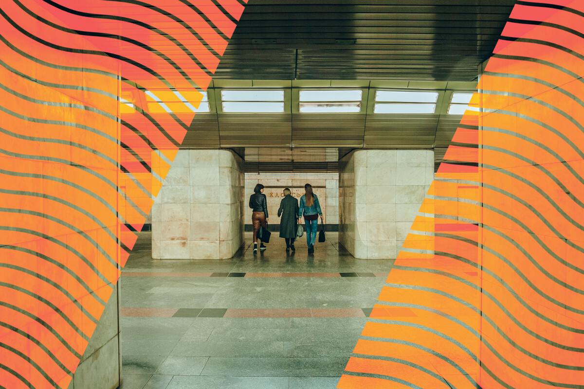 Students walking into an underground station